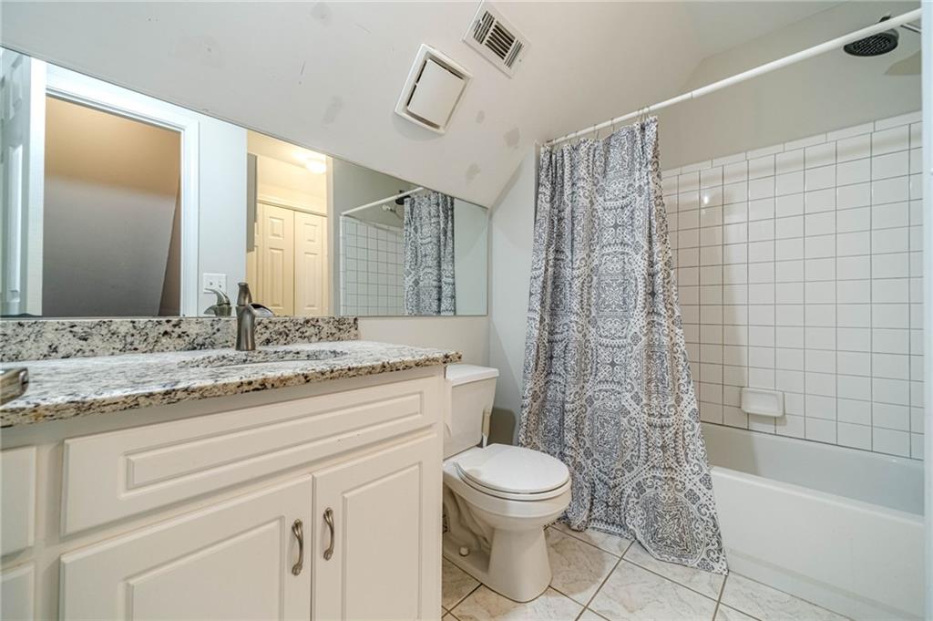 4415 Locklin Road Monroe, GA 30655 - Photo 38 of 79 a bathroom with a granite countertop sink a toilet and shower