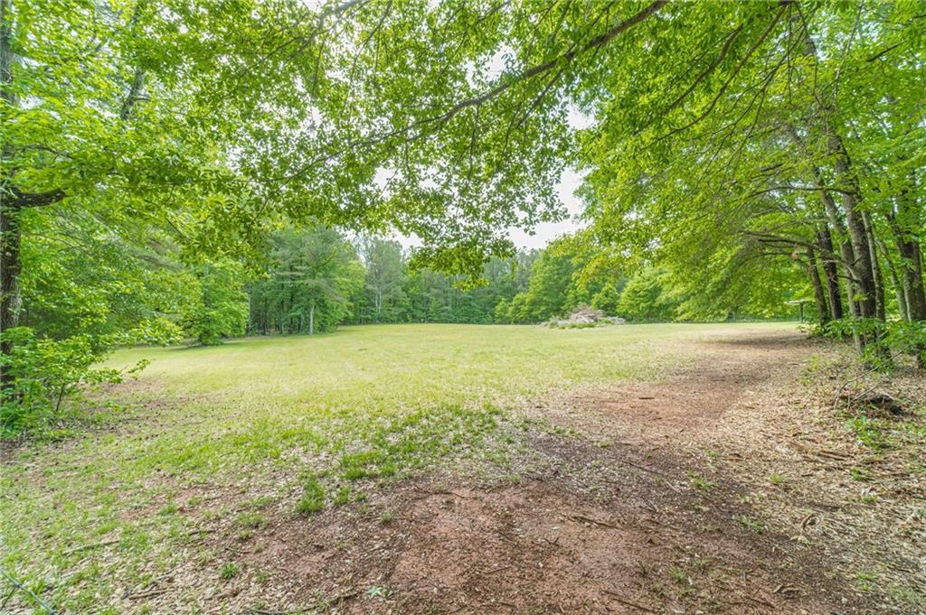 4415 Locklin Road Monroe, GA 30655 - Photo 59 of 79 a view of outdoor space with deck and yard