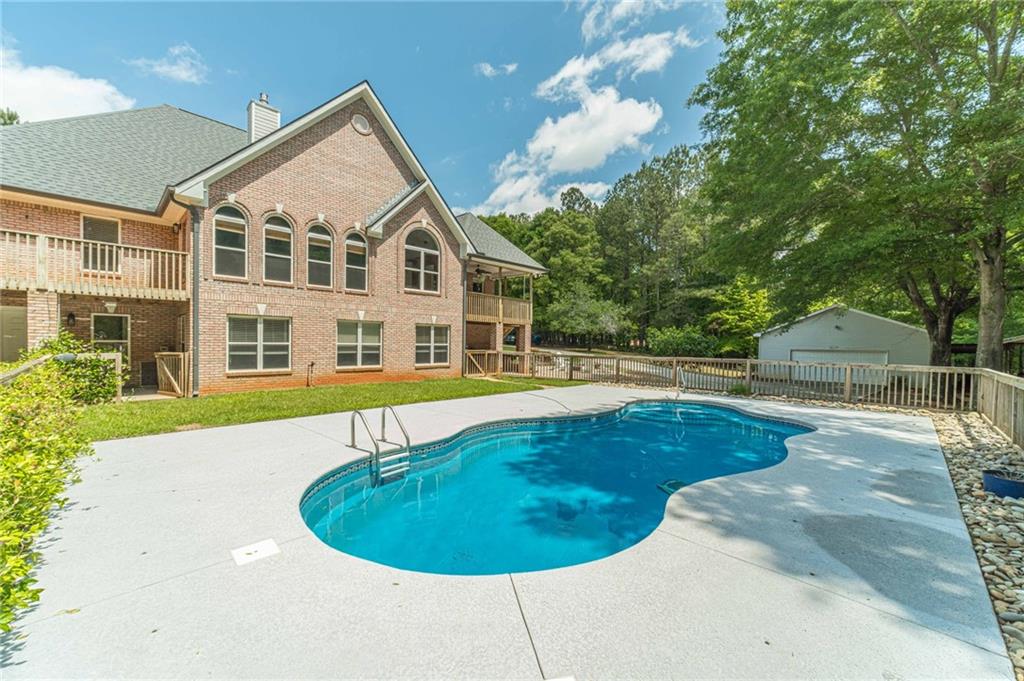 4415 Locklin Road Monroe, GA 30655 - Photo 60 of 79 a view of outdoor space yard swimming pool and porch