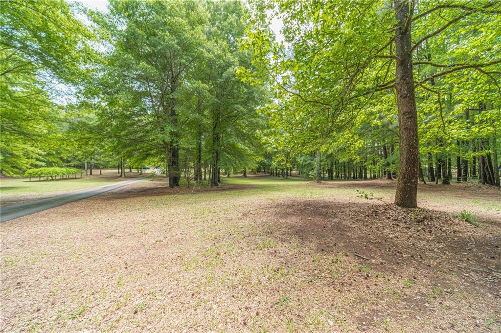 4415 Locklin Road Monroe, GA 30655 - Photo 75 of 79 a view of outdoor space with deck and yard
