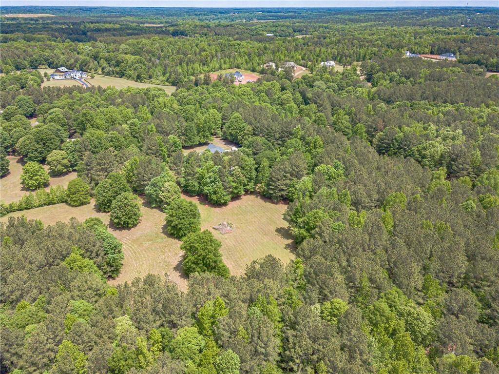 4415 Locklin Road Monroe, GA 30655 - Photo 79 of 79 an aerial view of residential houses with outdoor space and trees