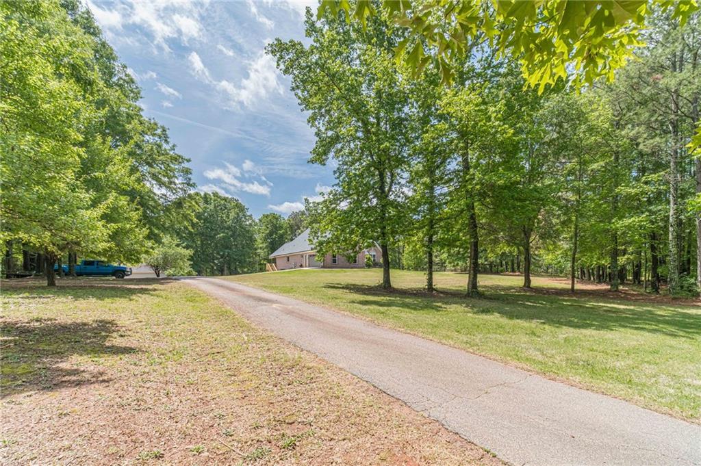 4415 Locklin Road Monroe, GA 30655 - Photo 10 of 79 a view of a park with large trees