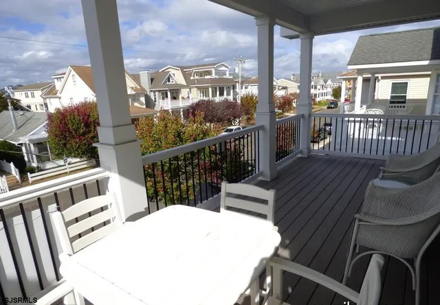 a view of a balcony with chairs