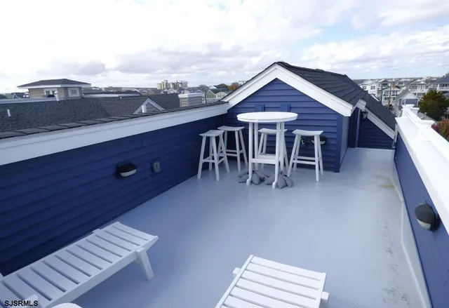 a view of a terrace with chairs