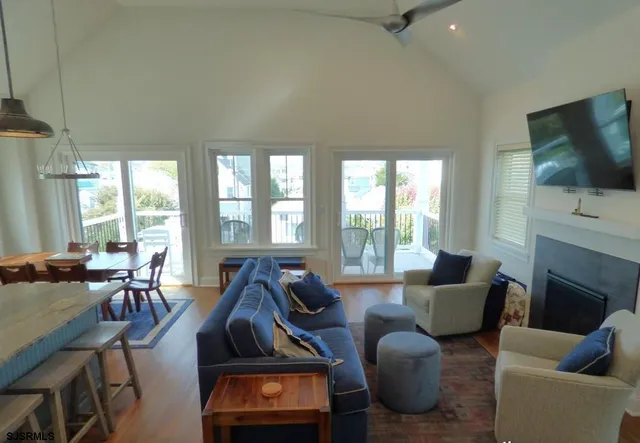 a living room with fireplace furniture and a flat screen tv