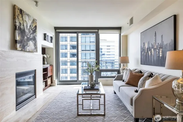 a living room with furniture and a fireplace