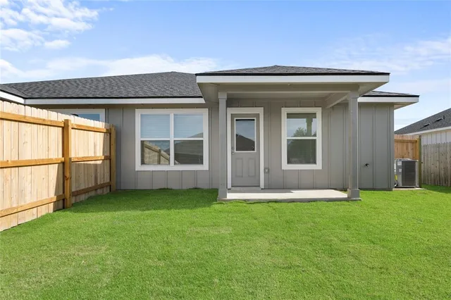 a view of front door of house with yard