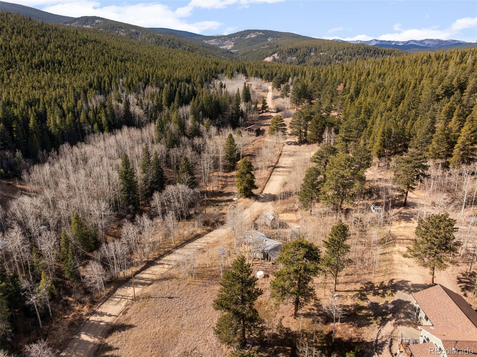 757 Lower Travis Gulch Road Black Hawk, CO 80422 - Photo 30 of 31 a view of a town with mountains in the background