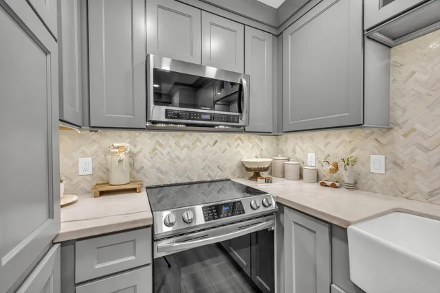 a kitchen with a sink and cabinets