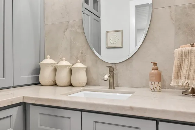 a bathroom with a sink and a mirror