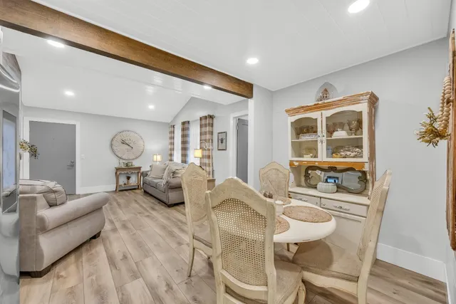 a living room with furniture and a table