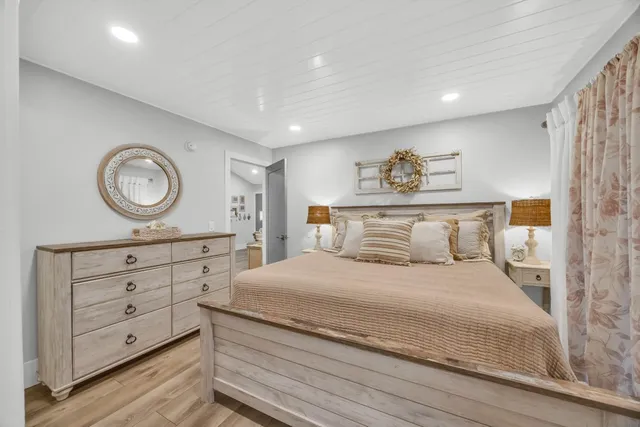 a bedroom with a bed and a dresser