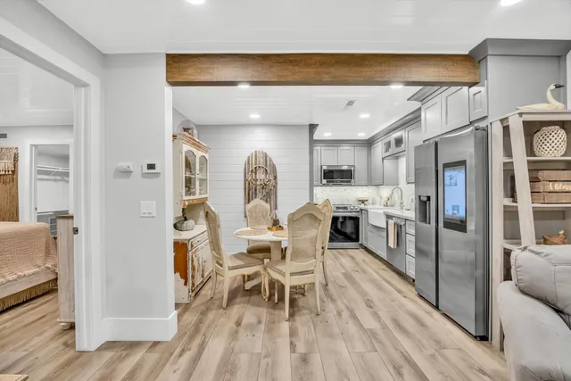 a view of a dining room with furniture window and wooden floor