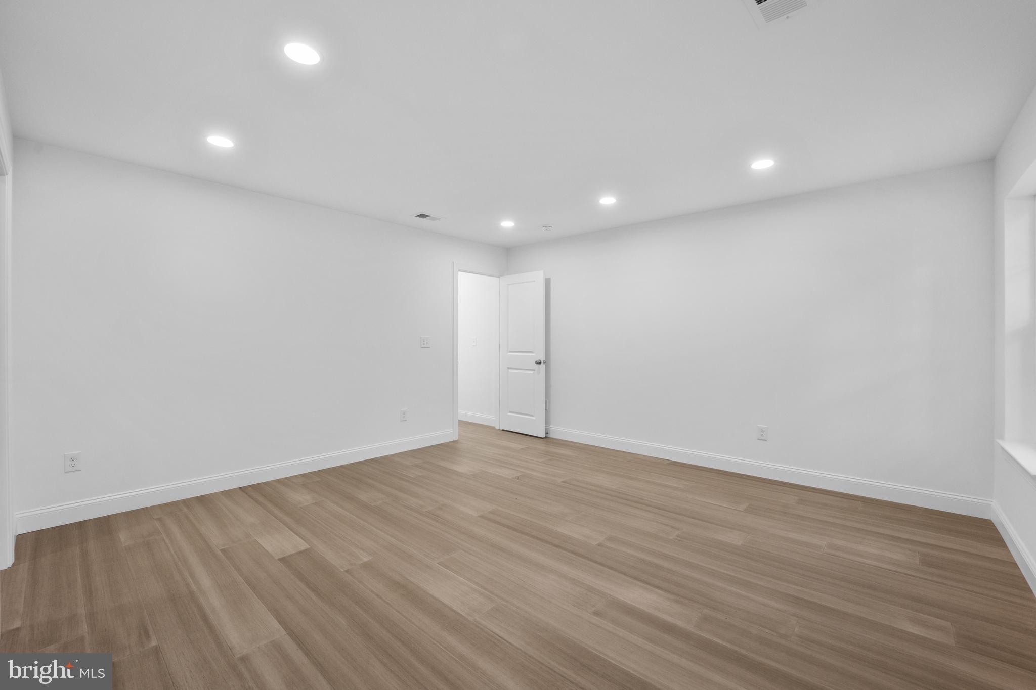 492 Ellis Avenue Lawnside, NJ 08045 - Photo 27 of 33 a view of an empty room with wooden floor