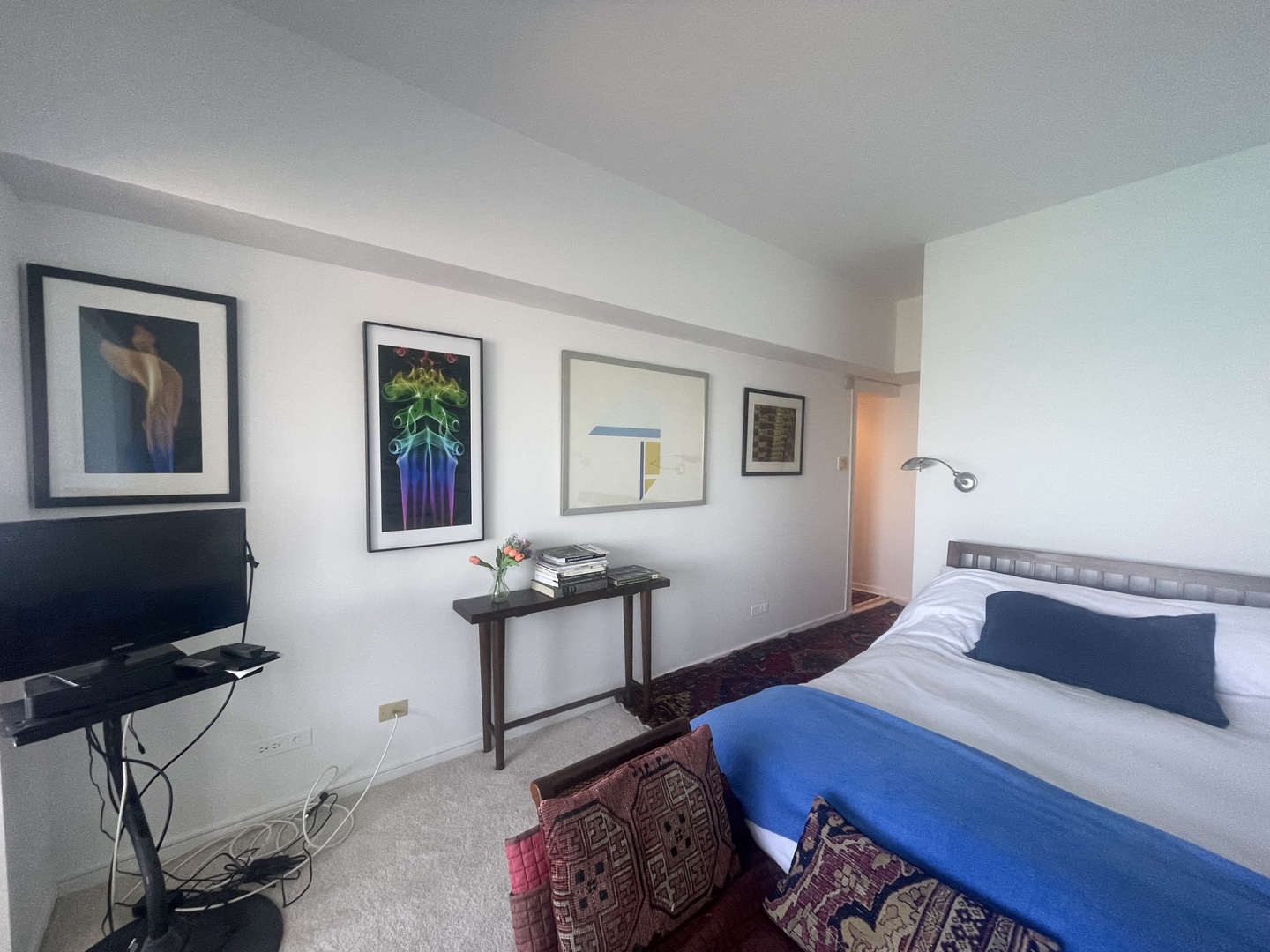 175 East Delaware Place, Unit 5403 Chicago, IL 60611 - Photo 14 of 20 a bedroom with a bed and a table