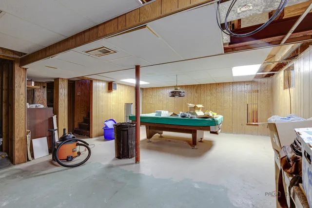 a room with furniture and air hockey table