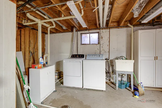 a view of a house with backyard and a patio