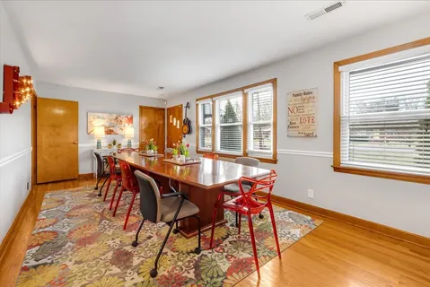 a dining room with furniture and window