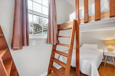 a view of an entryway with wooden floor and door