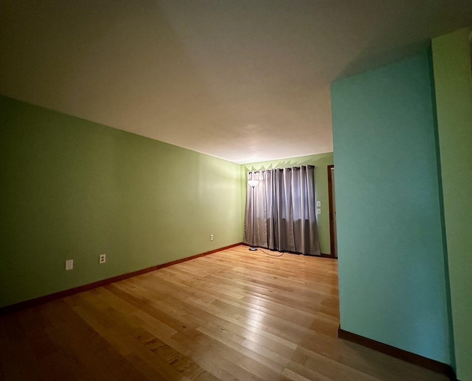 46 Swan Point Road Rindge, NH 03461 - Photo 15 of 42 an empty room with wooden floor and windows