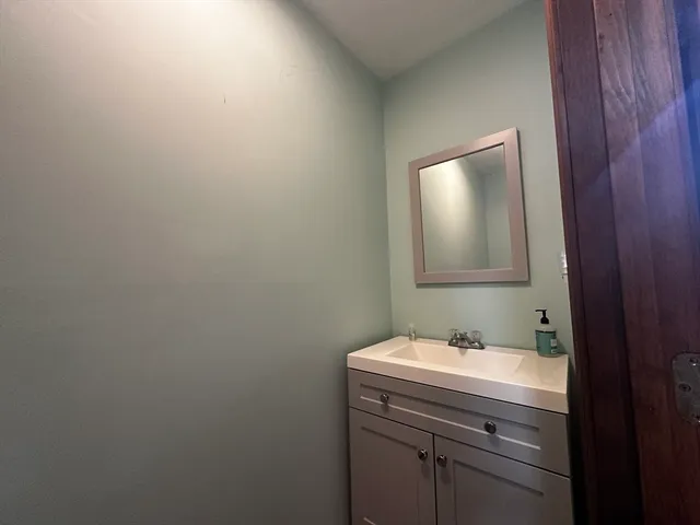 a bathroom with a sink and mirror