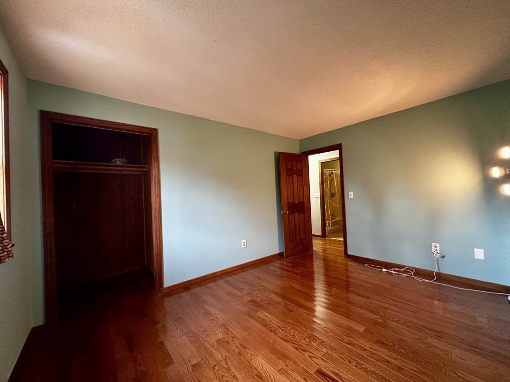 46 Swan Point Road Rindge, NH 03461 - Photo 23 of 42 a view of an empty room with wooden floor and closet
