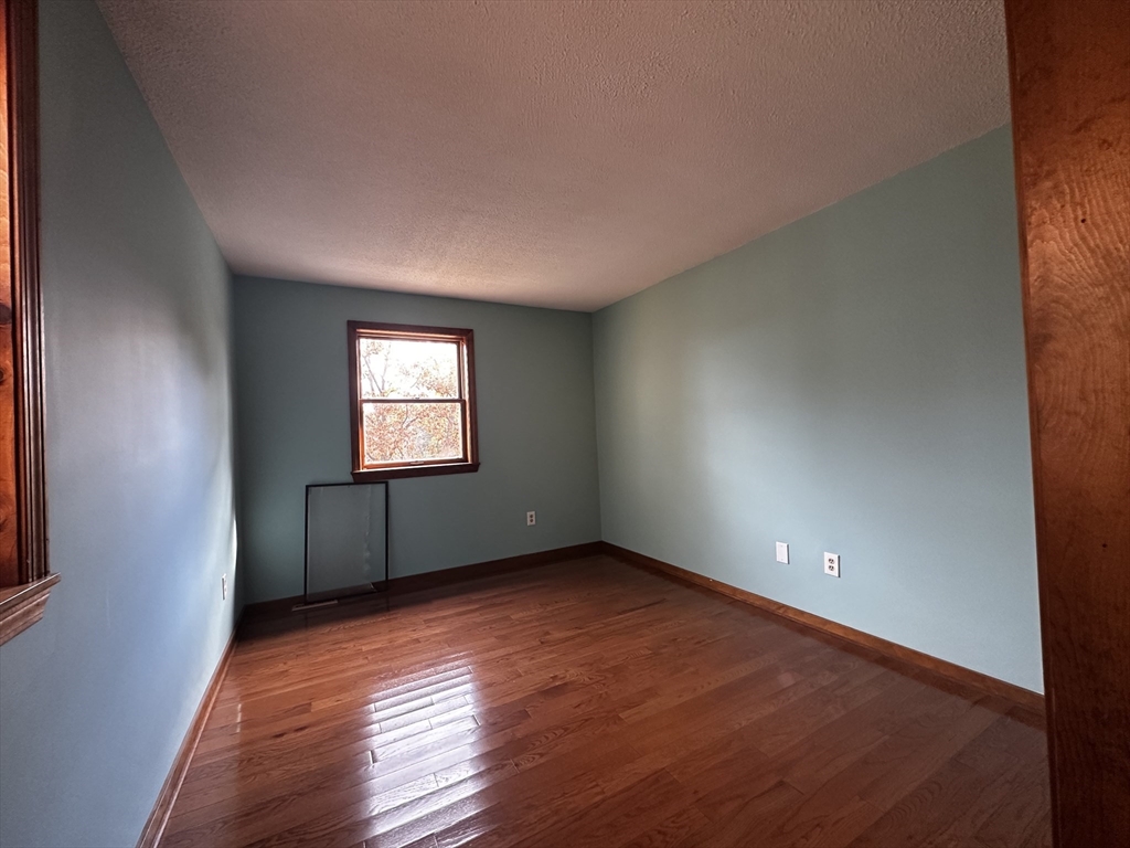 46 Swan Point Road Rindge, NH 03461 - Photo 26 of 42 an empty room with wooden floor and windows