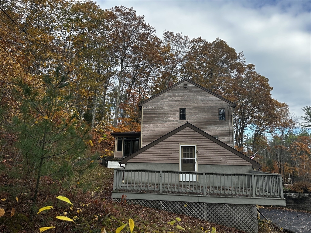 46 Swan Point Road Rindge, NH 03461 - Photo 3 of 42 a view of a house with a small yard plants and large tree