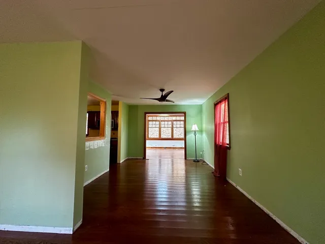a view of an entryway with wooden floor