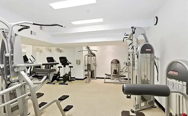 a view of swimming pool with outdoor seating and city view