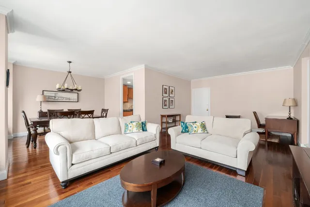 a living room with furniture and a table