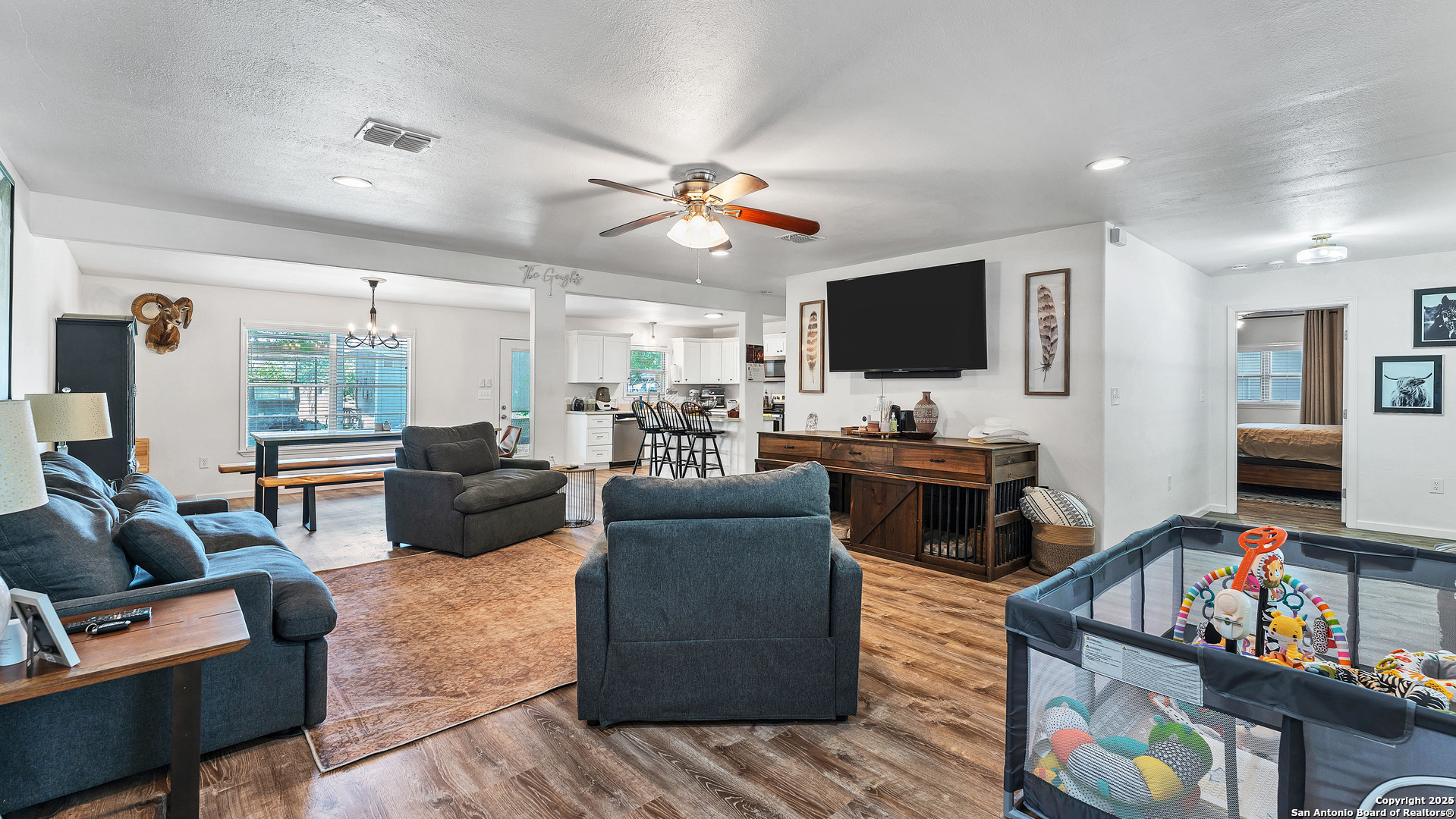 404 Reiley Road Seguin, TX 78155 - Photo 12 of 45 a living room with furniture and a flat screen tv