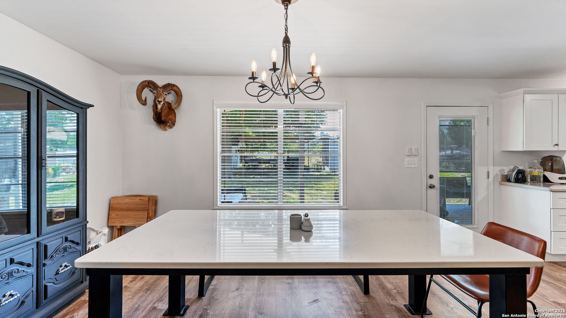 404 Reiley Road Seguin, TX 78155 - Photo 21 of 45 a view of a dining room with furniture window and wooden floor
