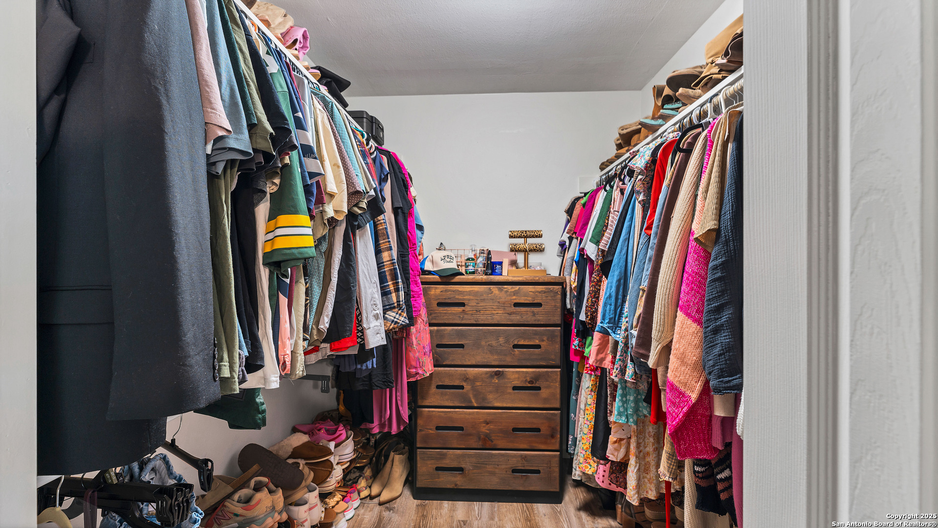 404 Reiley Road Seguin, TX 78155 - Photo 10 of 45 a view of walk in closet with clothes and shoes