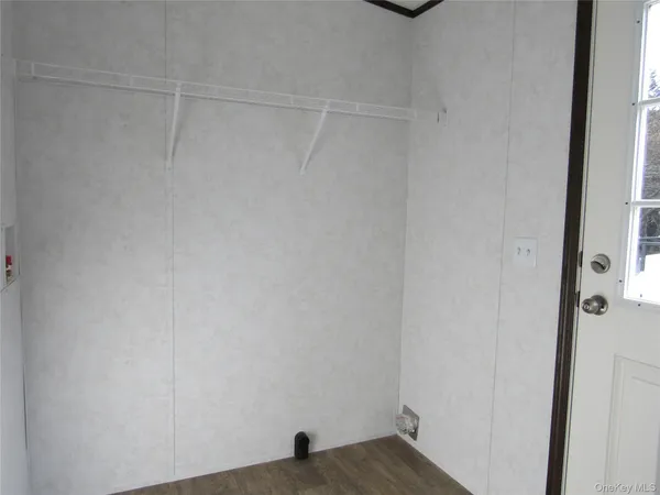 a view of small space with racks on the wall