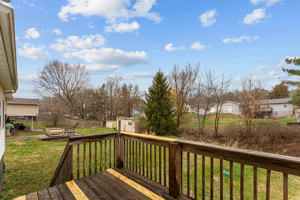 a view of a house with a yard and sitting area