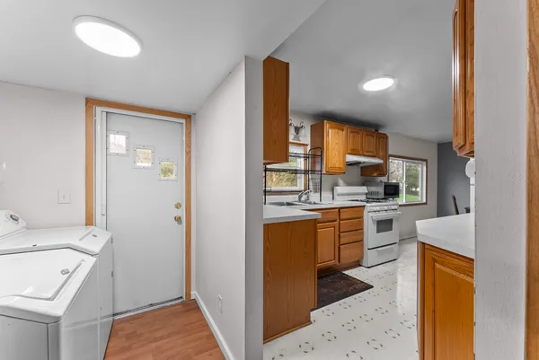 a kitchen with a sink stove and refrigerator