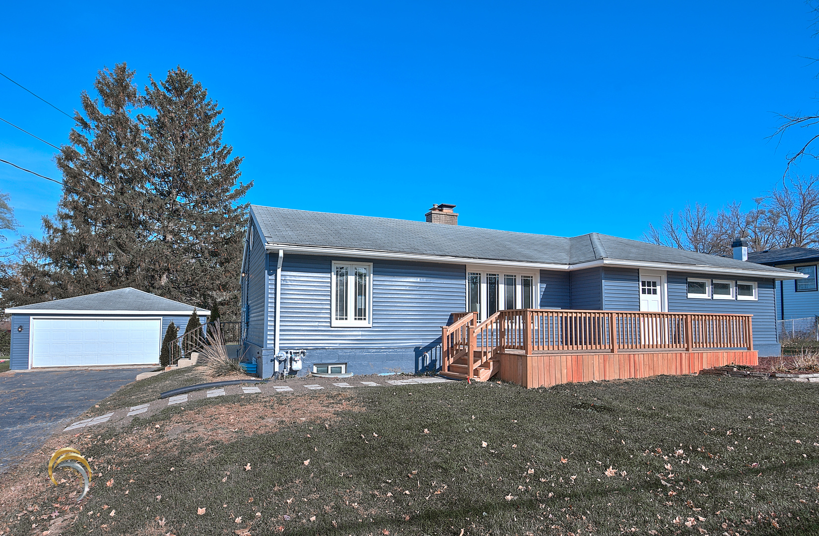 1016 Riedy Road Lisle, IL 60532 - Photo 2 of 17 a front view of a house with a yard and garage