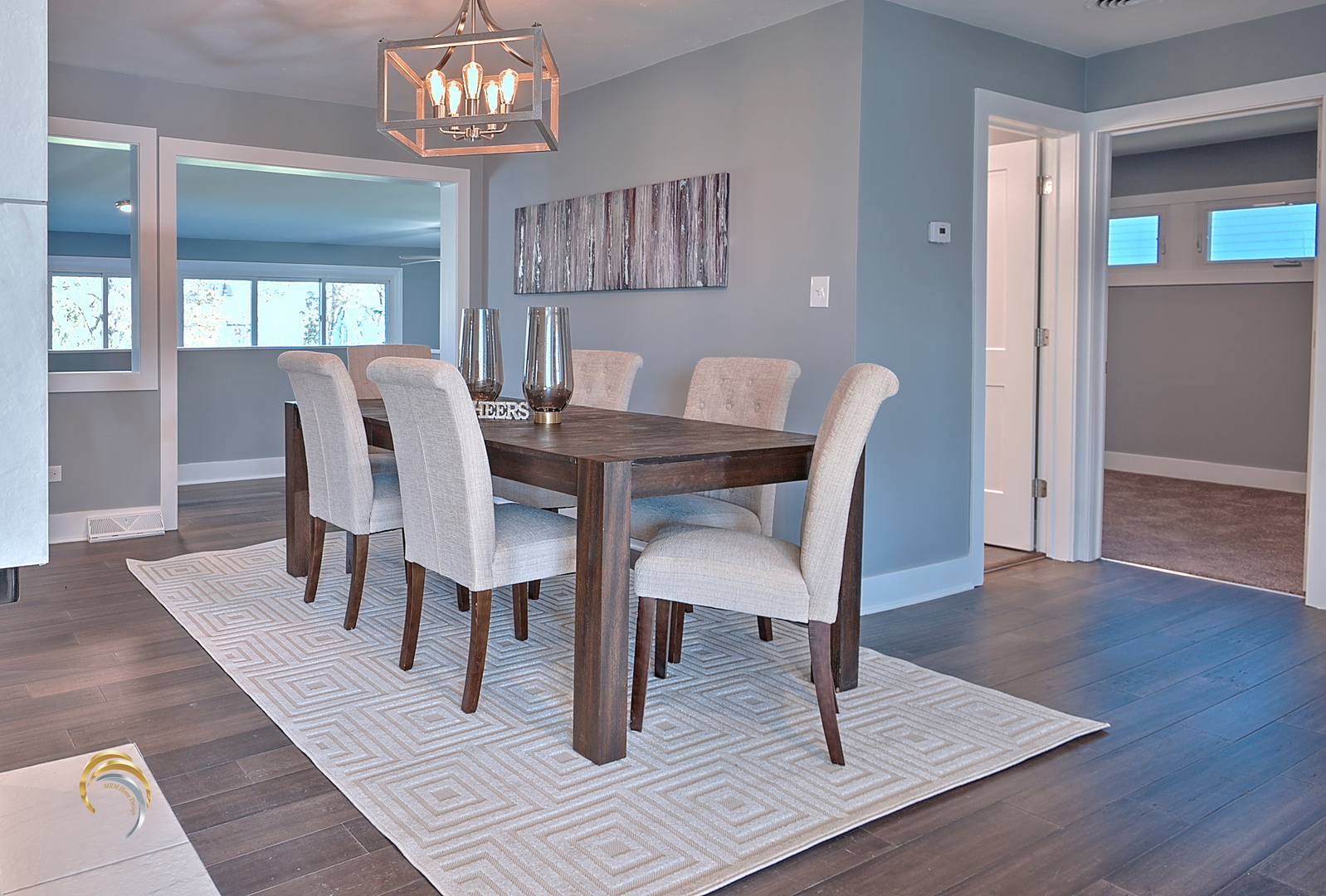 1016 Riedy Road Lisle, IL 60532 - Photo 7 of 17 a view of a dining room with furniture a chandelier and wooden floor