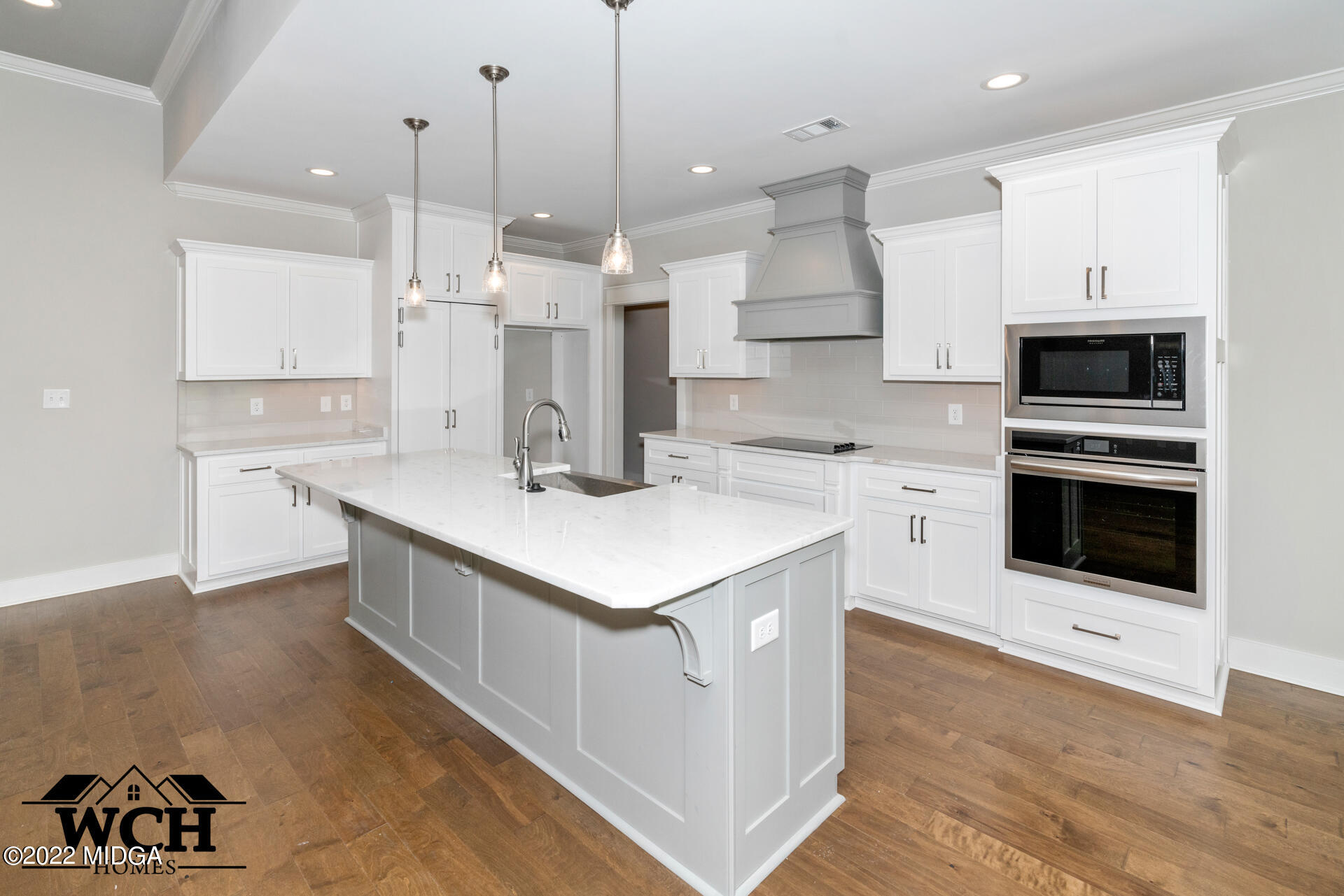 107 Perth Court Warner Robins, GA 31088 - Photo 14 of 27 a kitchen with a sink a stove a microwave and island