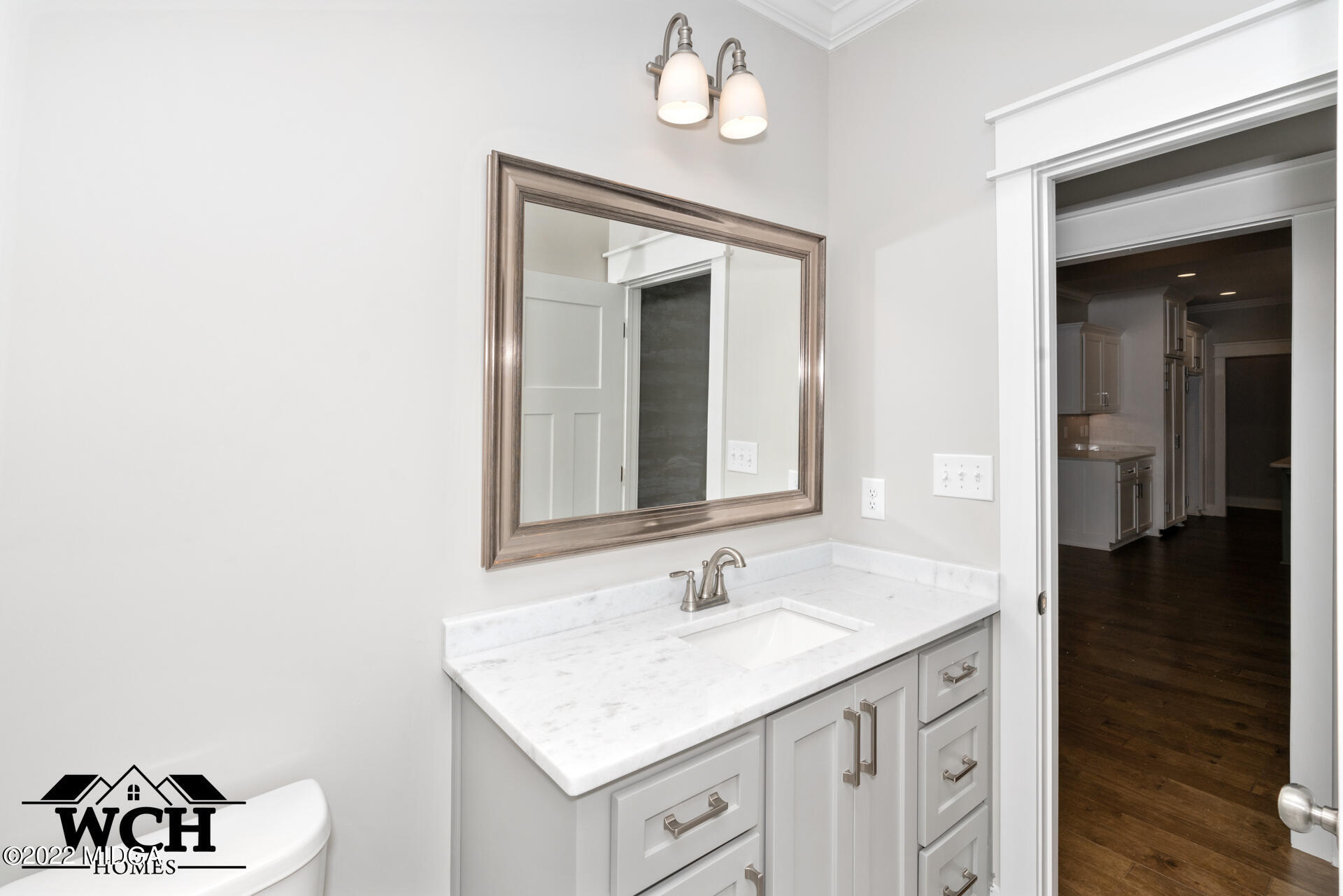107 Perth Court Warner Robins, GA 31088 - Photo 18 of 27 a bathroom with a sink a vanity and a mirror