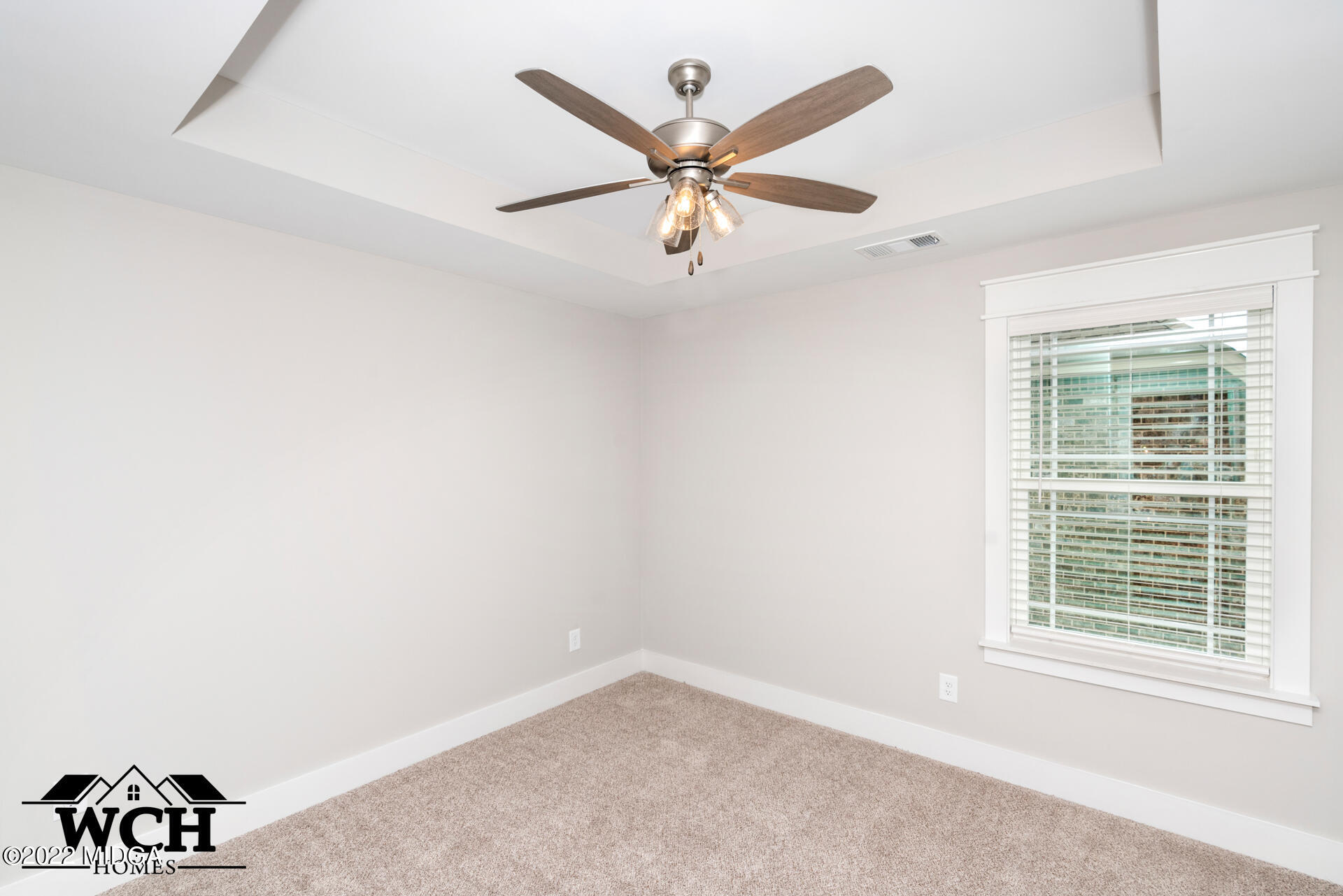 107 Perth Court Warner Robins, GA 31088 - Photo 20 of 27 an empty room with wooden floor ceiling fan and window