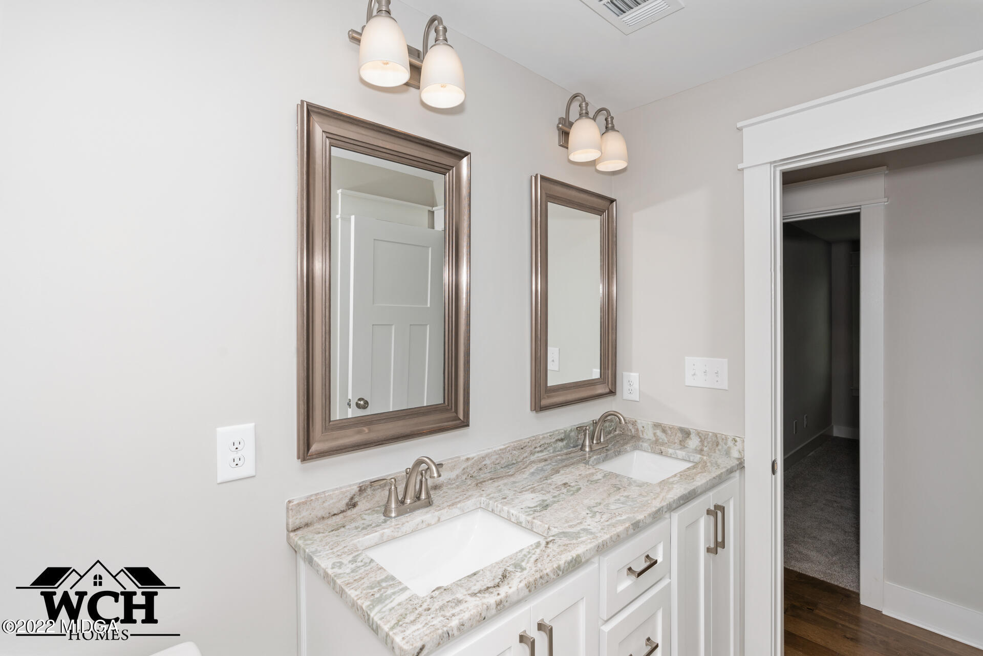 107 Perth Court Warner Robins, GA 31088 - Photo 23 of 27 a bathroom with a granite countertop sink and a mirror