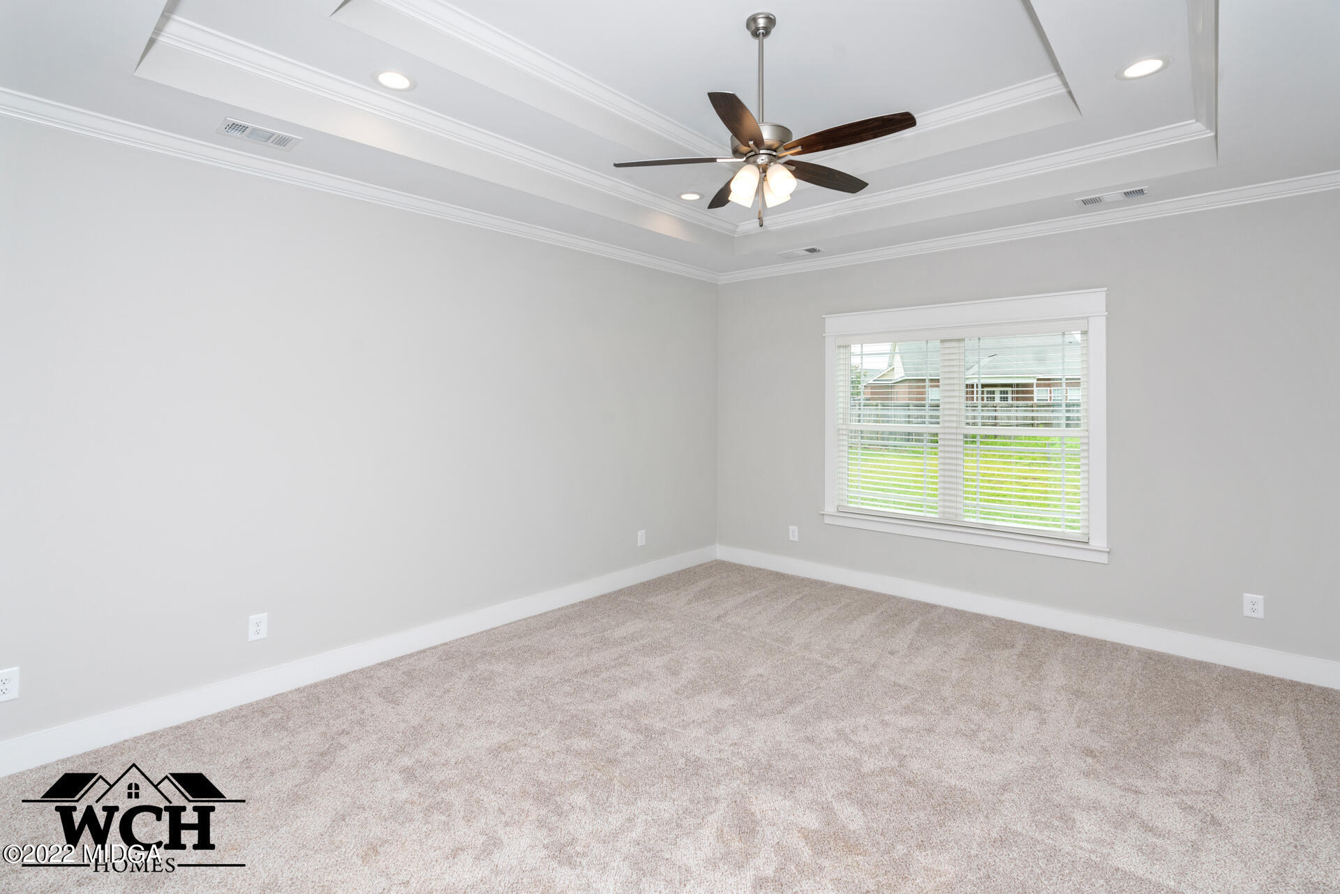107 Perth Court Warner Robins, GA 31088 - Photo 4 of 27 en empty room with window and ceiling fan