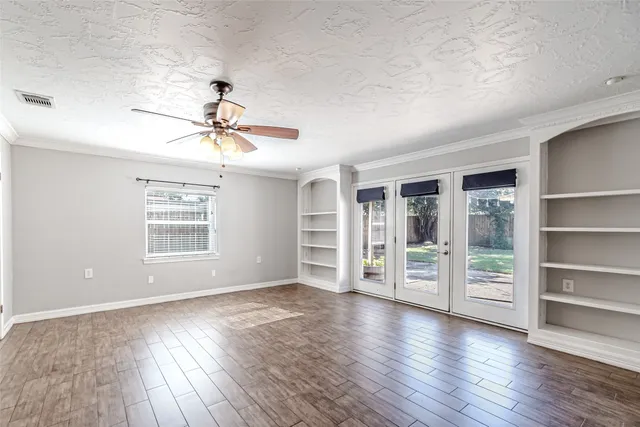 a white refrigerator freezer and a dishwasher in a white cabinet