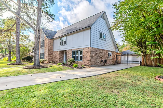 a view of a livingroom with wooden floor and furniture