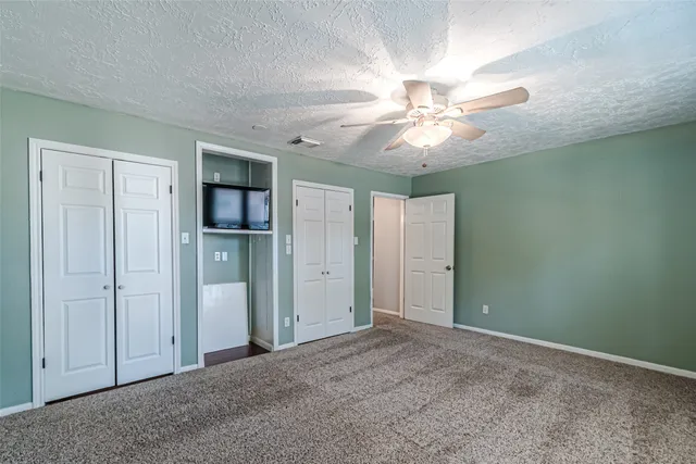 an aerial view of a house with a yard and garden