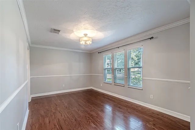a kitchen with kitchen island granite countertop a sink cabinets and stainless steel appliances