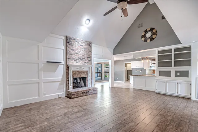a kitchen with a sink a stove top oven and cabinets