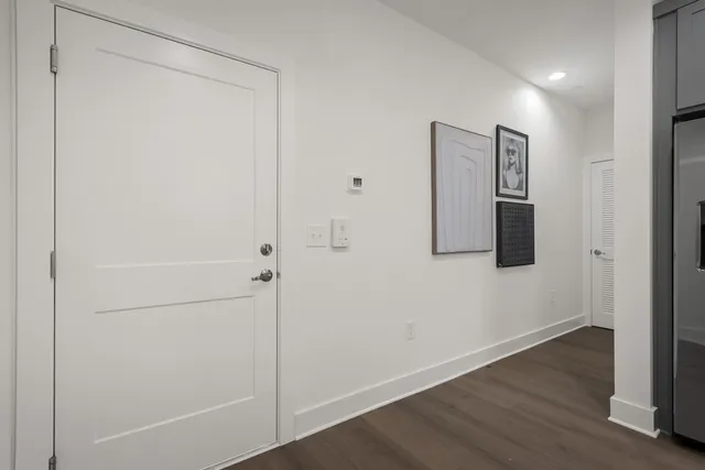 a kitchen with stainless steel appliances a refrigerator and cabinets